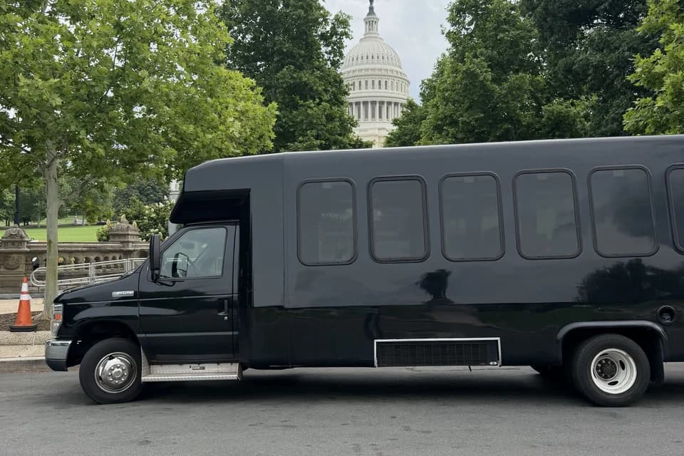 Shuttle van providing scheduled group transportation across the DMV