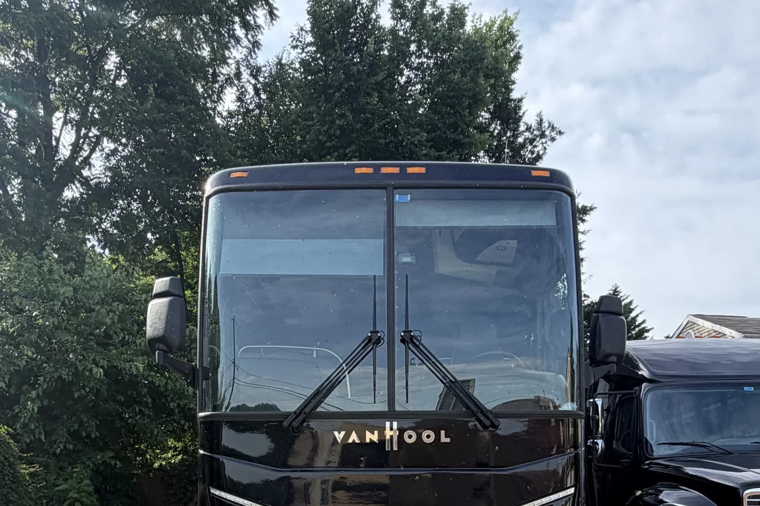 Comparison of a charter bus and a sprinter van used for shuttle service