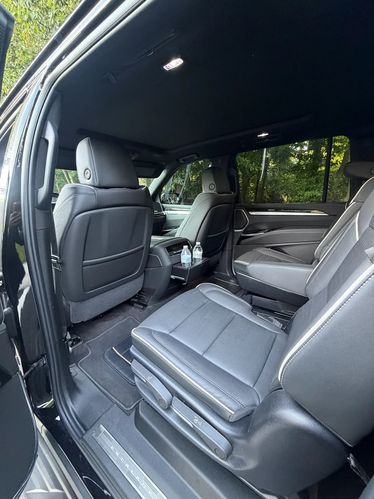Open door boarding view of an AZA Cadillac Escalade
