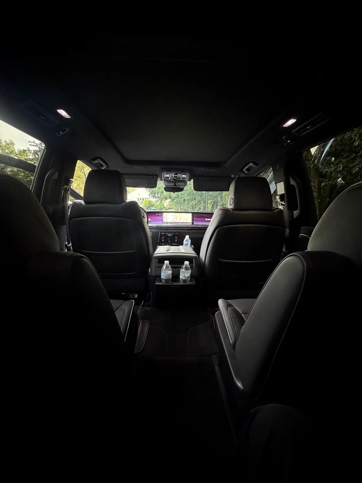 Wide interior view inside an AZA Cadillac Escalade in daylight