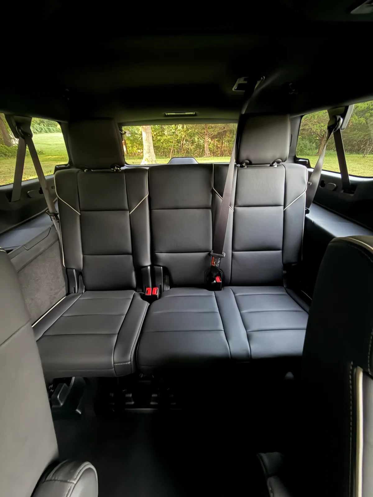 Third-row bench seating inside an AZA Cadillac Escalade