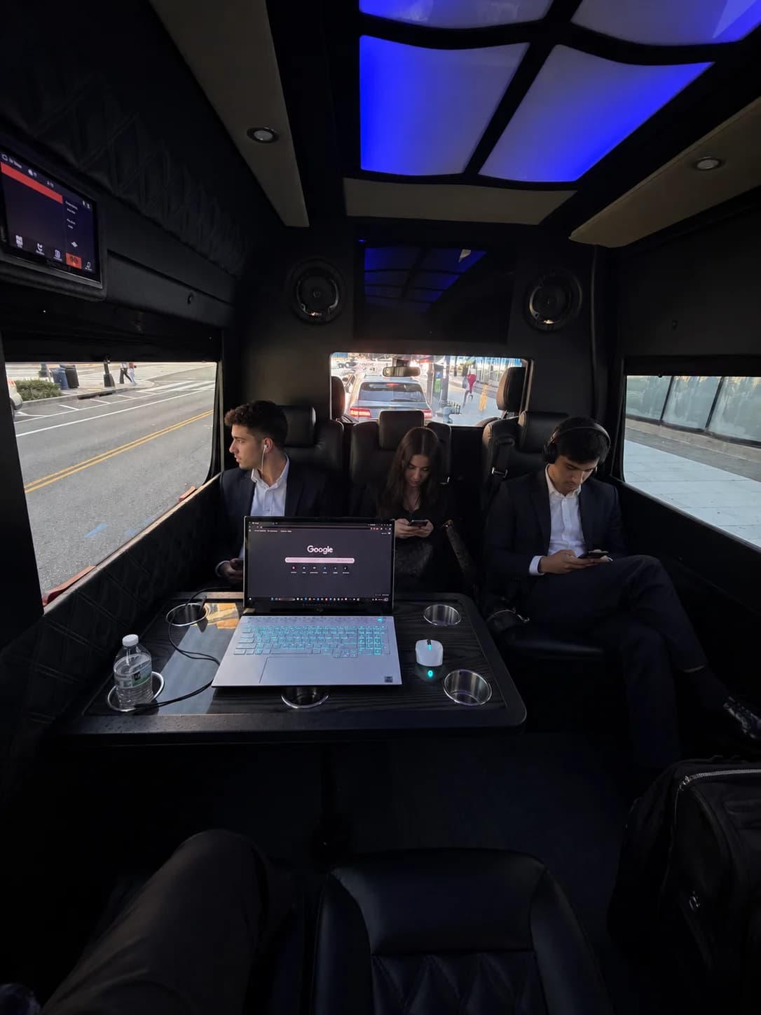 Corporate team riding together in an AZA Sprinter van