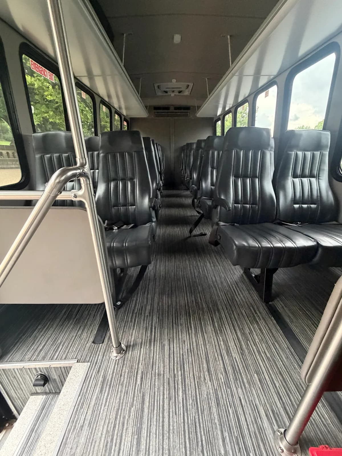 Boarding area and railings inside an AZA Ford E450 shuttle