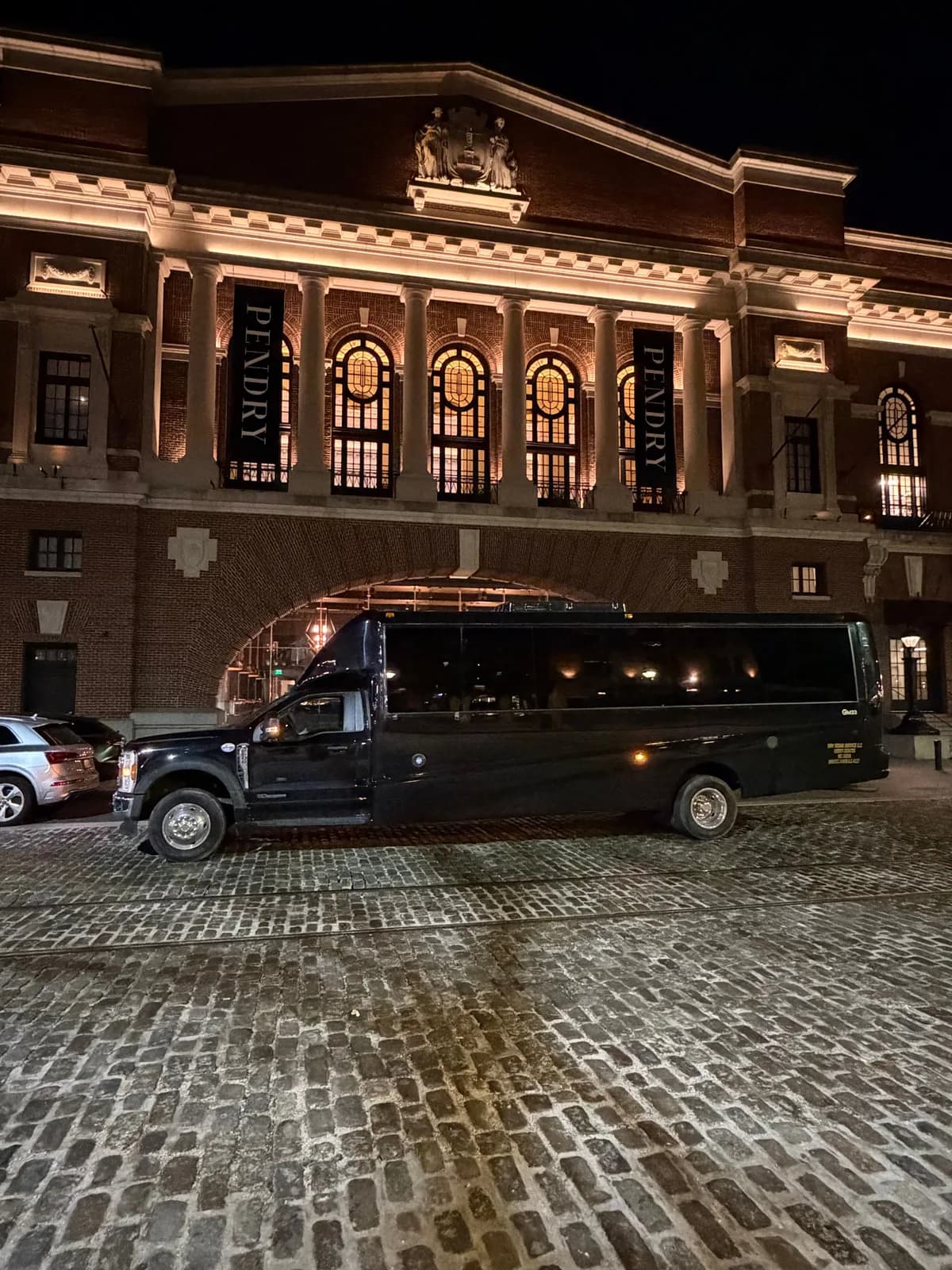 AZA Mini Party Bus parked outside a DC hotel at night