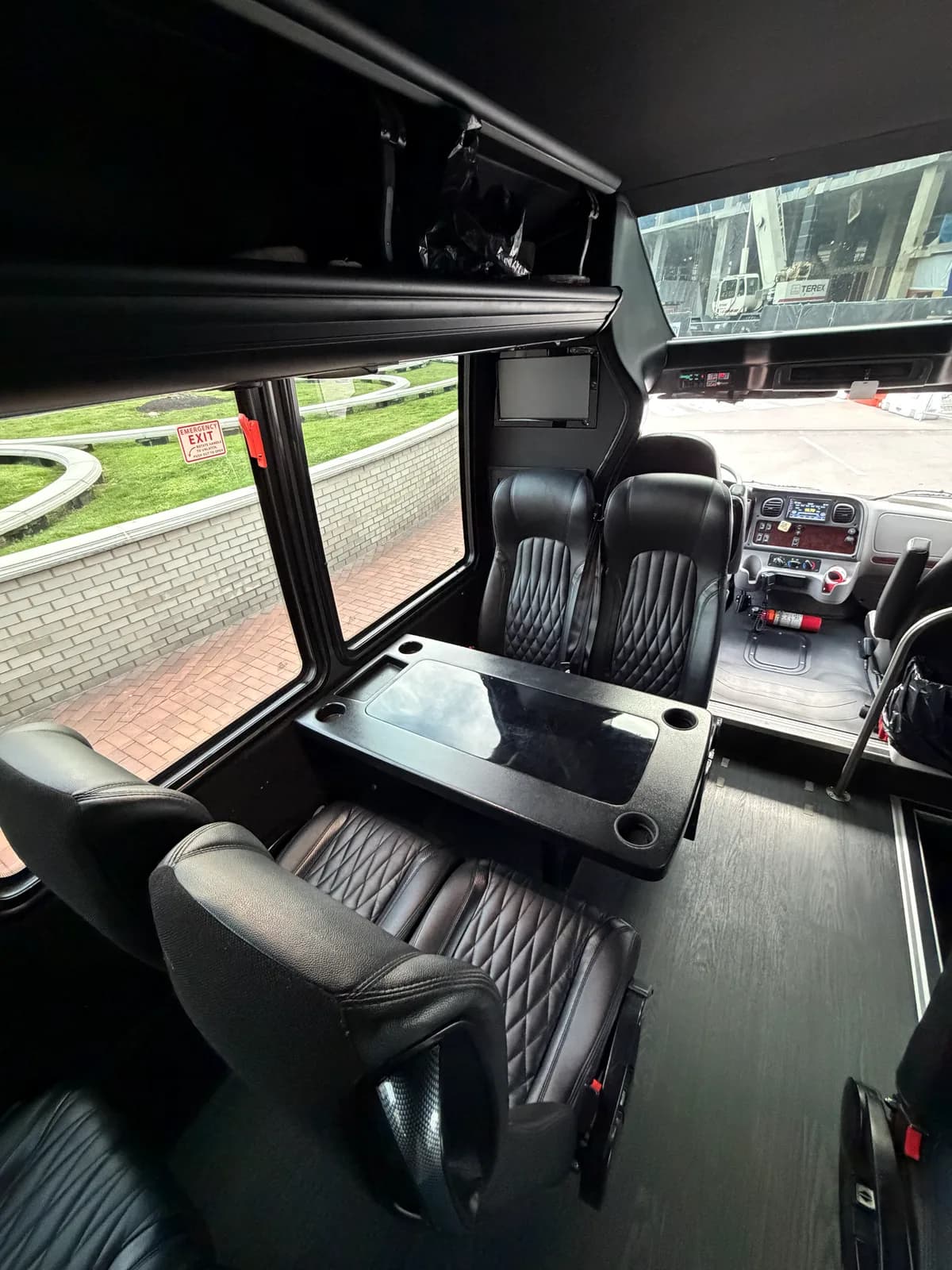 Purple LED-lit captain's chairs inside the AZA GM40 bus