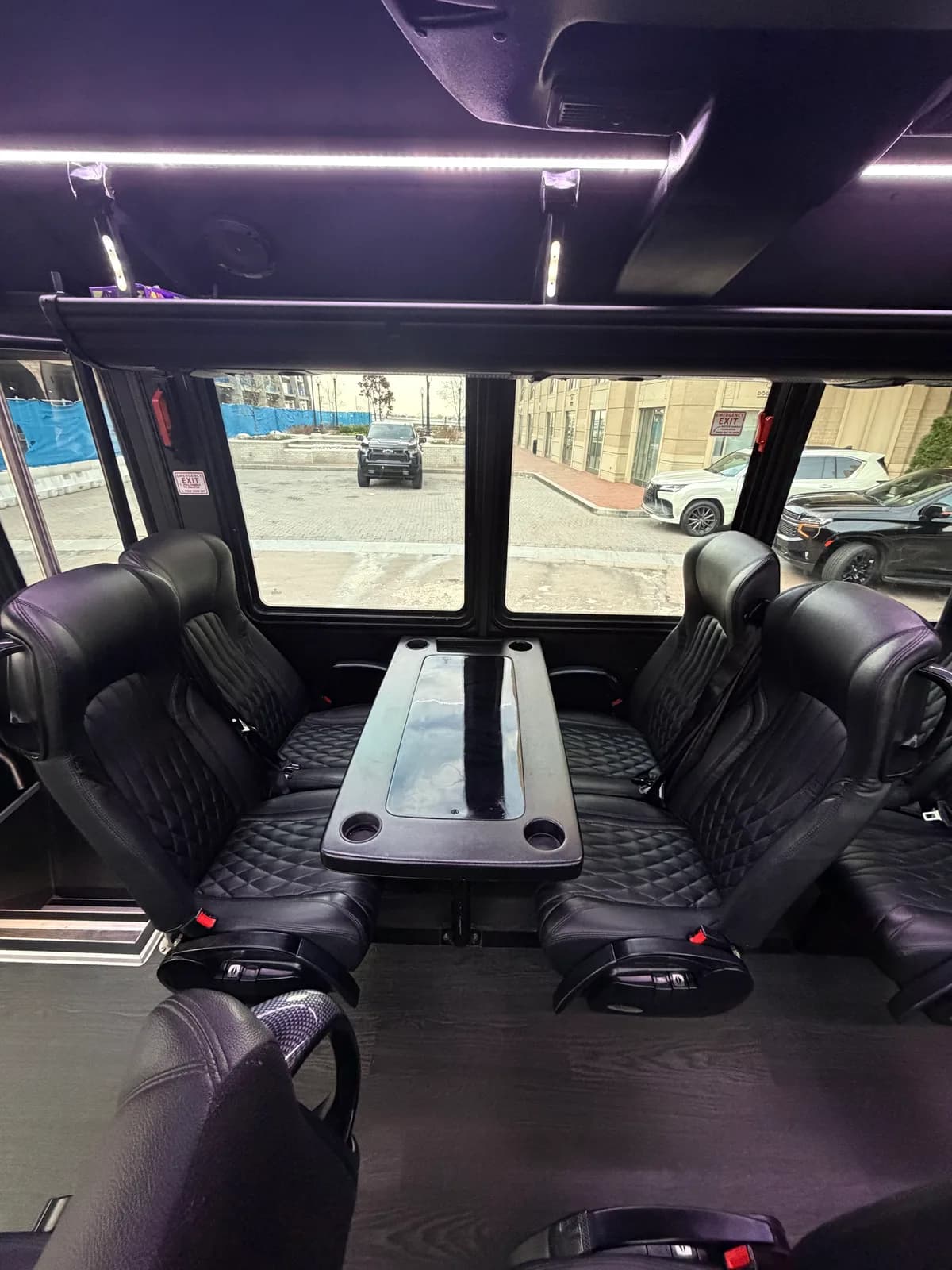 Table seating inside the AZA GM40 bus in daylight