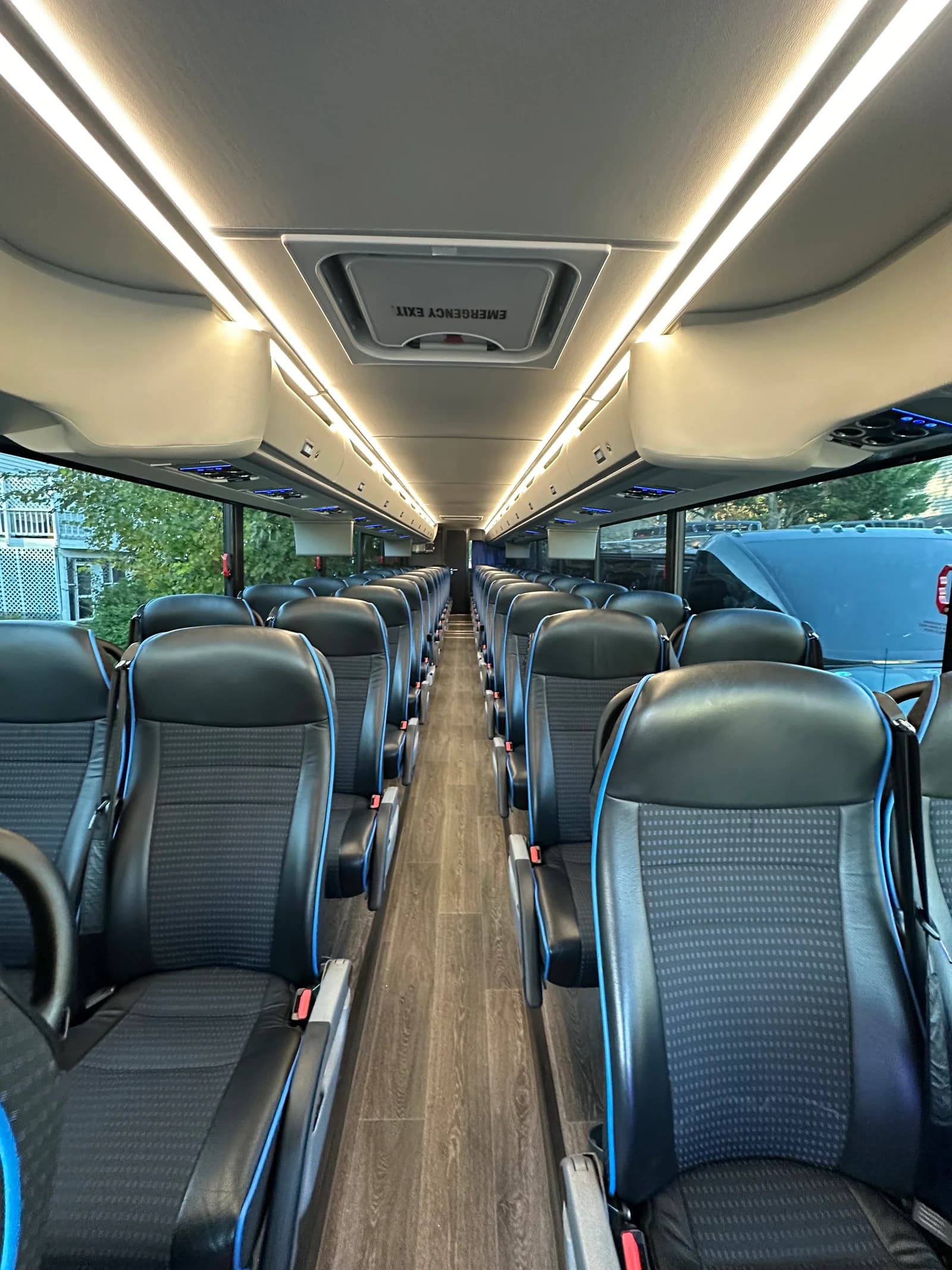 Motorcoach aisle seating for coordinated wedding guest transportation